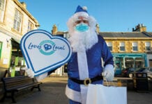 Blue santa with Scotland Loves Local sign