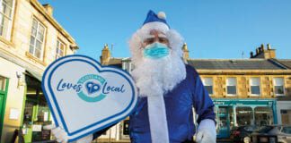 Blue santa with Scotland Loves Local sign