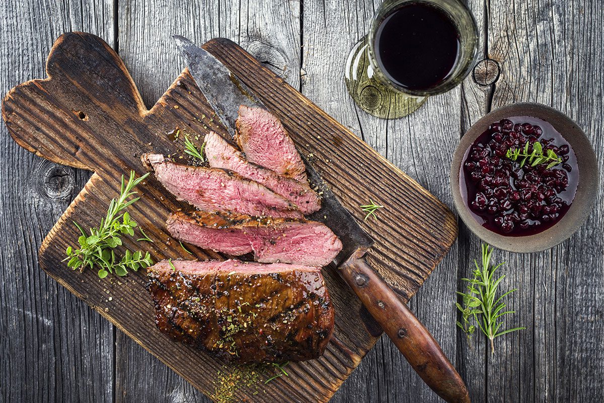 Vanison Steak on old Cutting Board