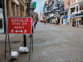 Covid rules relaxing for retail covid sign on high street