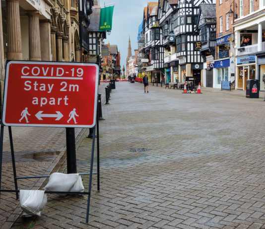 Covid rules relaxing for retail covid sign on high street