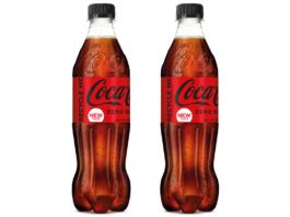 Doubling up on recycled 2 bottles of Coca Cola Zero Sugar against a white backgroun.