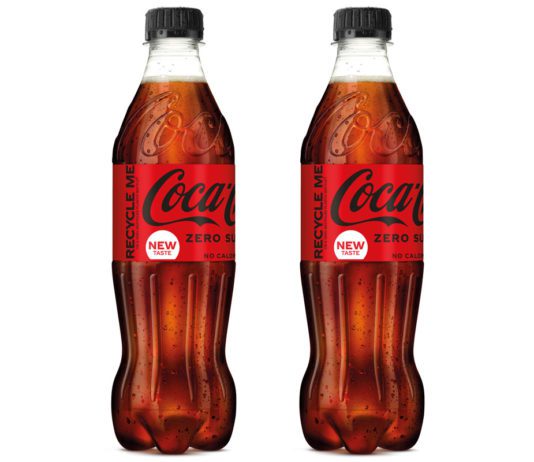 Doubling up on recycled 2 bottles of Coca Cola Zero Sugar against a white backgroun.