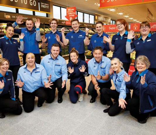 Aldi goes on a hiring bonanza Aldi Staff smiling and posing in photo in store