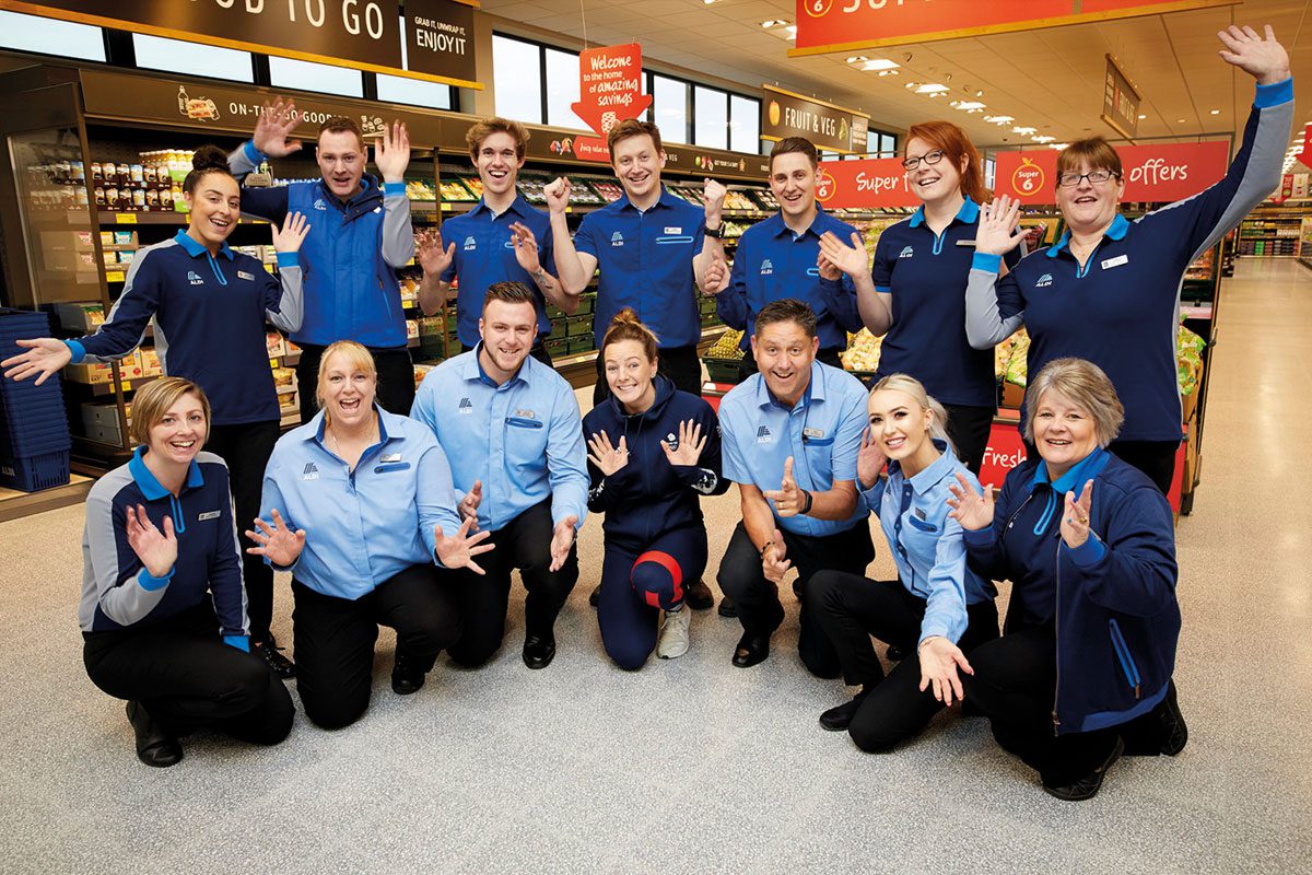 Aldi Staff smiling and posing in photo in store