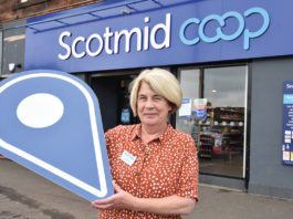 Fund offering millions open A woman standing outside Scotmid Coop Store Front