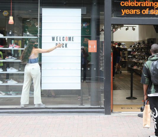 Covid still biting retail Store Front which reads "Welcome Back"