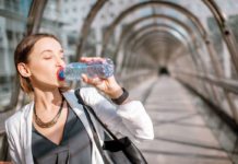 Woman drinking water from bottle