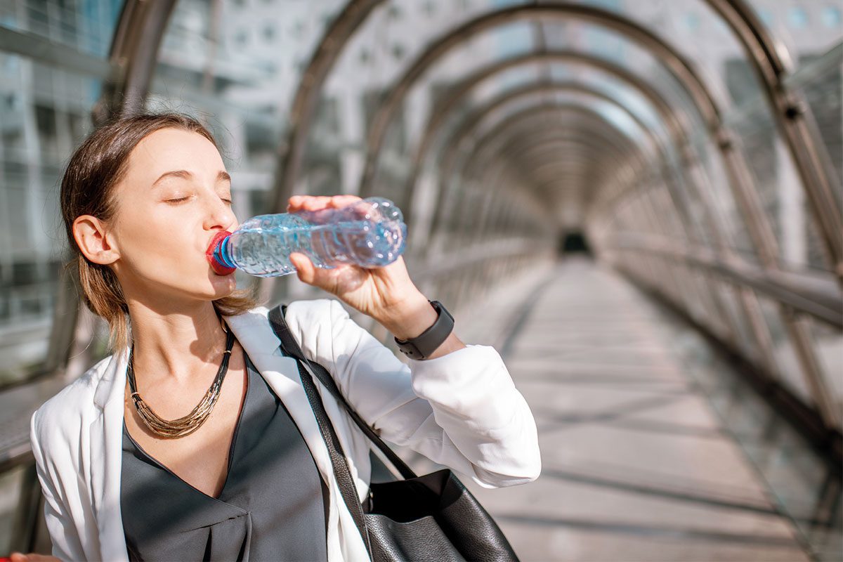 Woman drinking water from bottle