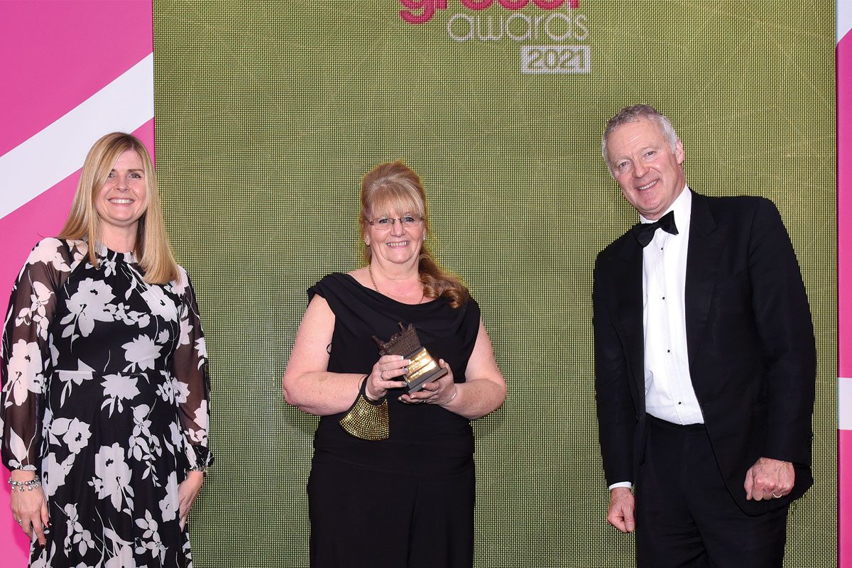 Tracy McNeil collected her prize from Kerry McAlpine of CCEP and Scottish Grocer Awards host Rory Bremner.