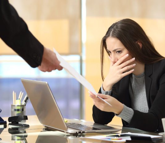 Fire and rehire is risky business woman receiving notice at work