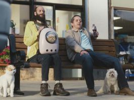 Cheeky campaign men sitting on a bench drinking Ribena