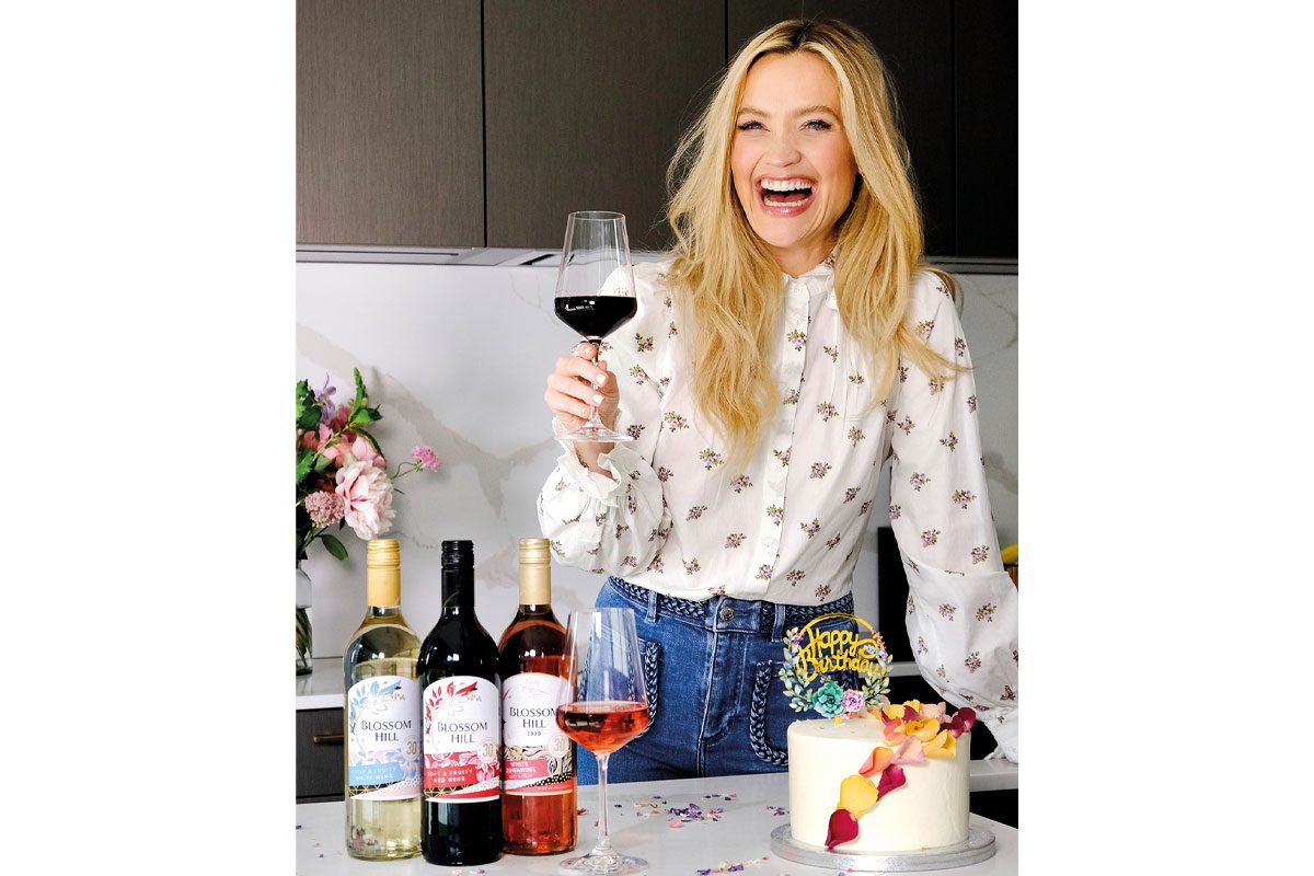 Laura Whitmore with Blossom Hill wine