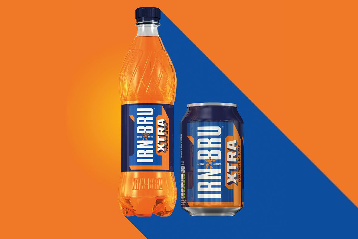Irn bru xtra bottle and can on an orange and blue background
