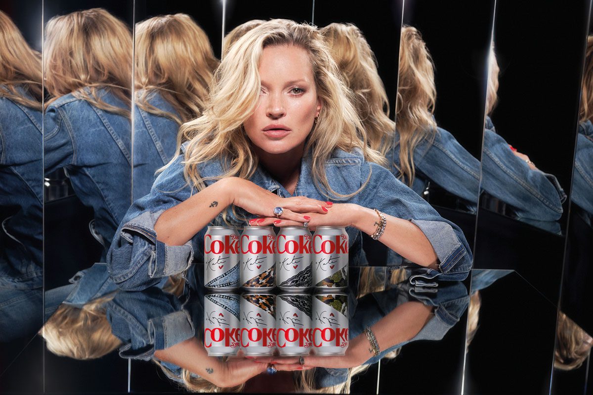 Kate Moss posing with signed cans of diet coke