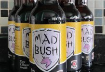 Bottles of Mad Bush lager showing label with clydebank fc logo