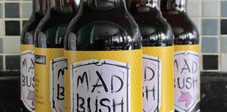 Bottles of Mad Bush lager showing label with clydebank fc logo