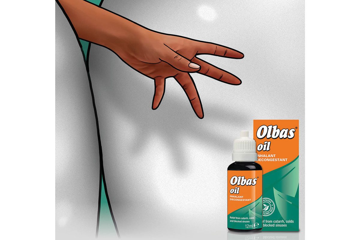 hand reaching for Olbas bottle