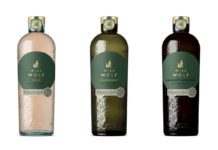 three bottles of Wise Wolf wine in rose, white and red