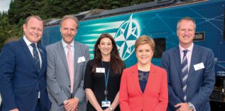 first minister nicola sturgeon stands with highland spring executives