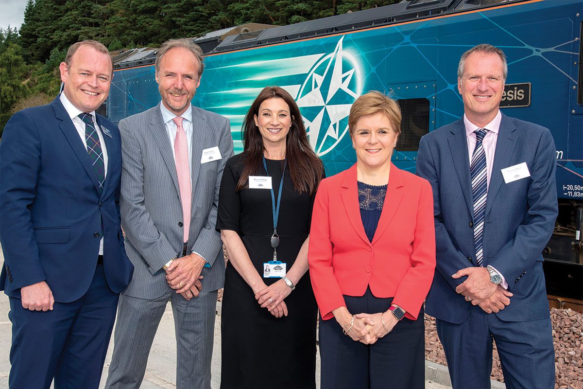 first minister nicola sturgeon stands with highland spring executives 