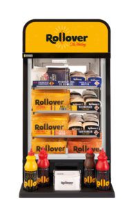 A rollever hotdog vending machine filled with hotdogs burgers and sauces