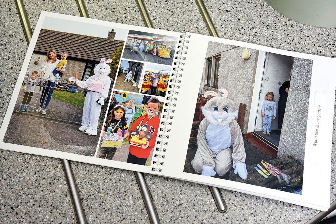 a bound photobook showing an easter bunny delivering eggs to children