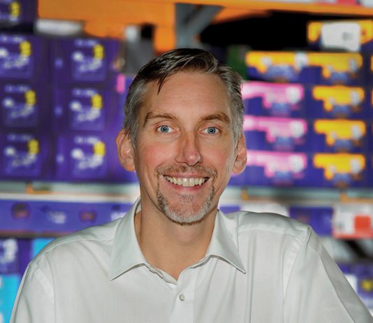 Time for retailers to act on environment photograph of colin smith standing with a wholesale confectionary goods