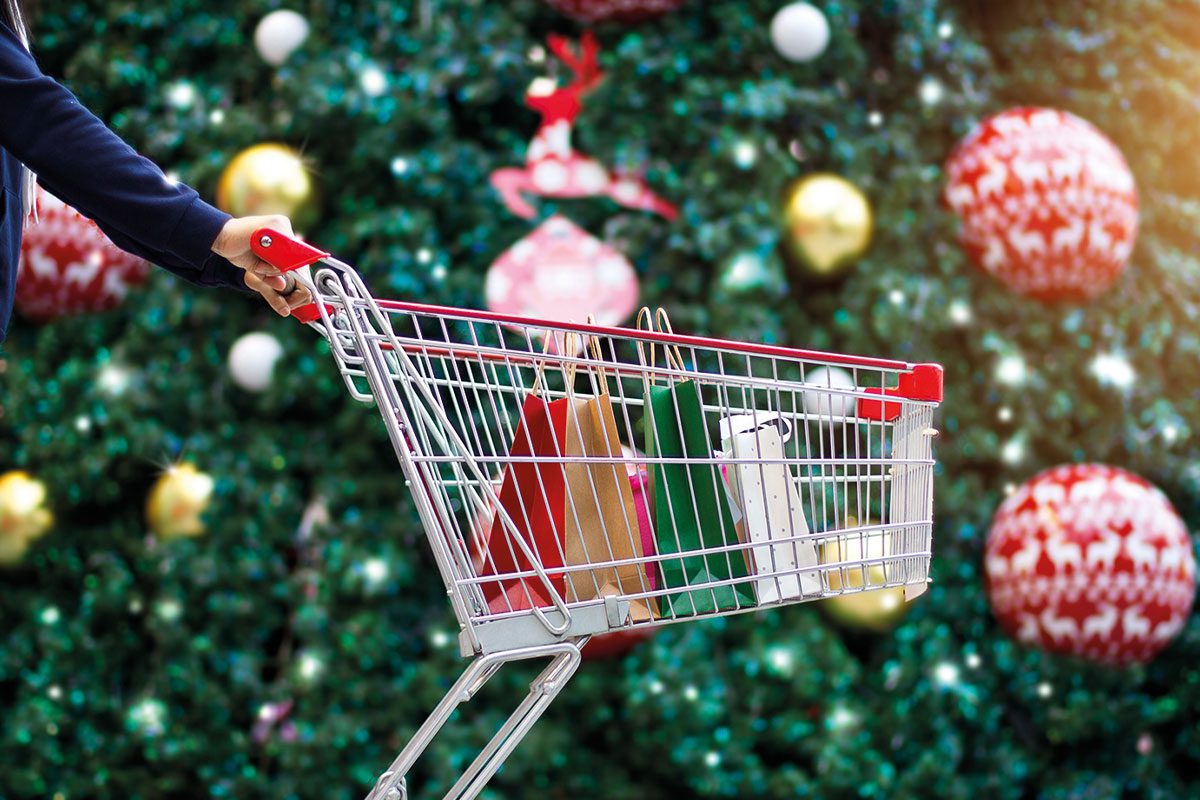 a shopping trolley infront of a christmas tree