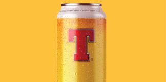 a can of tennent's lager of a yellow background