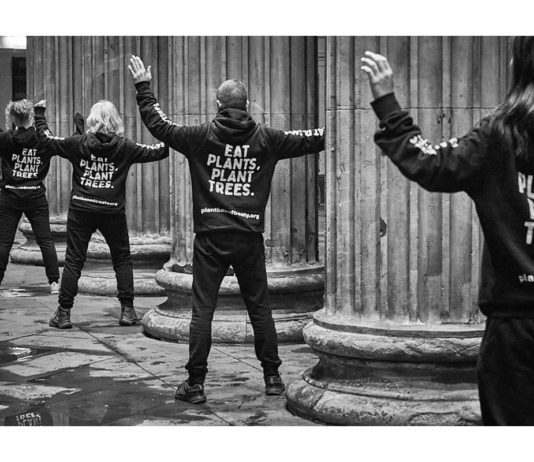 Rooting for diet change people wearing "eat plants. plant trees" hoodies