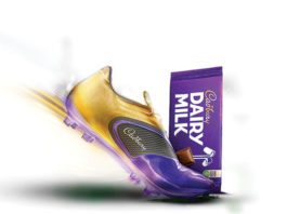 Competition kick off football boot and a bar of dairy milk