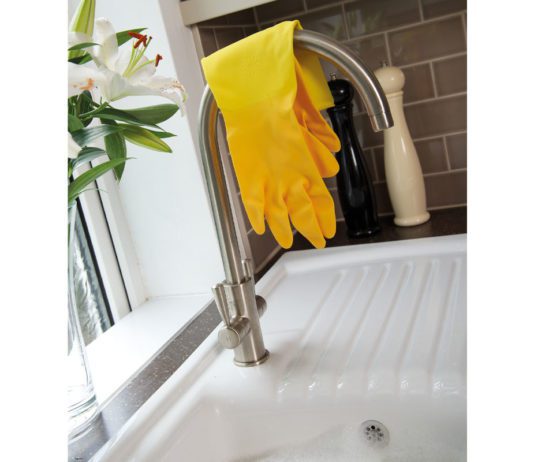 Shop for the future rubber gloves resting over a tap