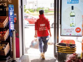 Delivering solutions that help everyone Snappy Shopper delivery man walking out of a convenience store
