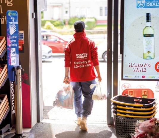 Delivering solutions that help everyone Snappy Shopper delivery man walking out of a convenience store