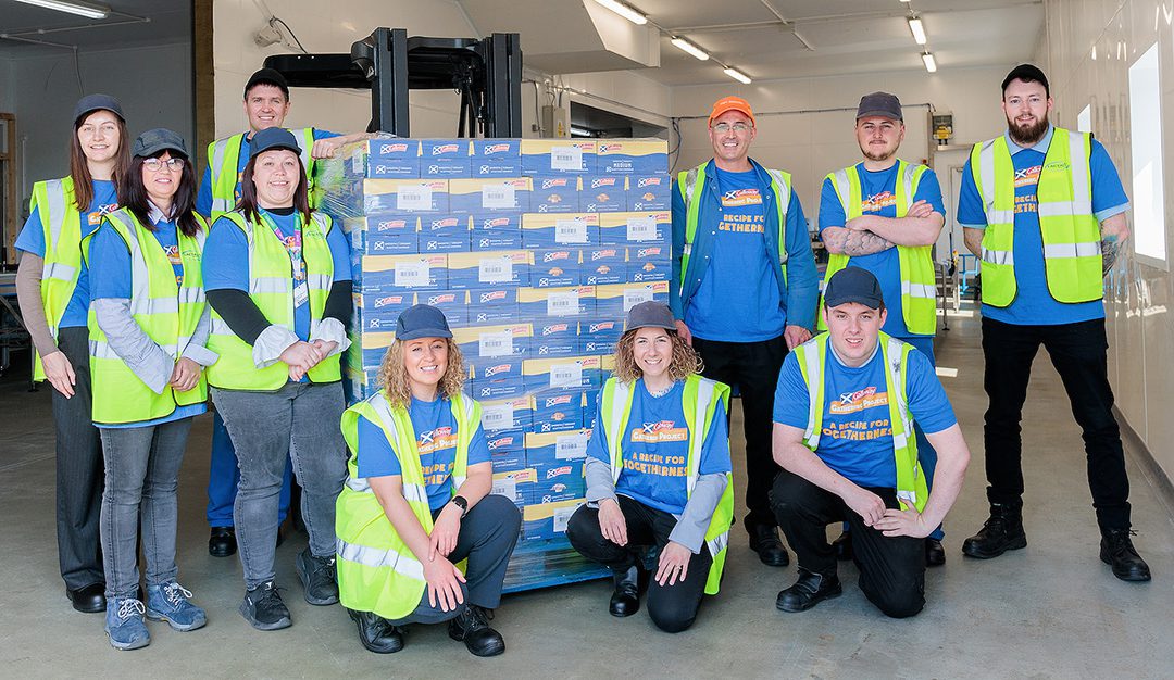 Martina Stocchi, of Lactalis, and FareShare's Clare O'Keeffe with Galloway Cheddar staff.