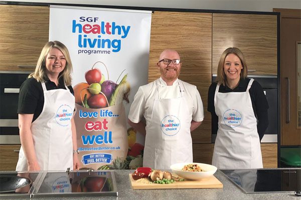 SGF's Healthy Living Programme at a demo in a kitchen, from left to right: Gillian Edgar, Gary McLean and Kathryn Neil