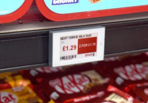 Electronic shelf edge label displaying the price of Nestle Yorkie Milk Duo, £1.29 2 for £1.70.