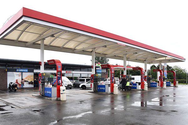 Image of a petrol forecourt station with multiple lanes.