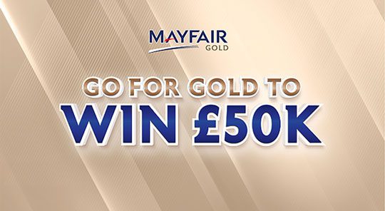 Advert for Mayfair's Go for Gold competition with the Mayfair Gold logo on top of a golden background. The text reads: 'Go For Gold to Win £50k'.