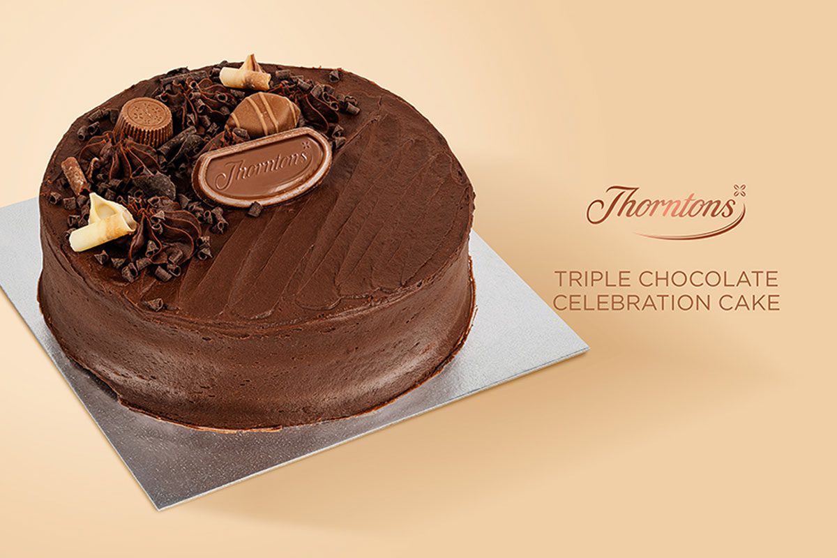 Image shot of Thorntons Triple Chocolate Celebration Cake against a soft gold background. Text reads: Thorntons Tripe Chocolate Celebration Cake.