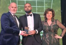 Shajaz Ali is congratulated by Booker Group retail development controller Barry Forbes and 2023 awards host Elaine C Smith.