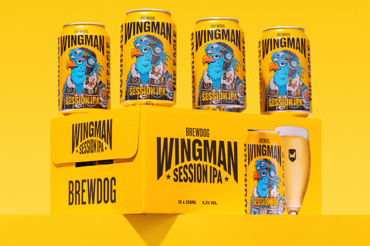 Four cans of BrewDog Wingman IPA sit on top of a crate of the beers against a yellow background.