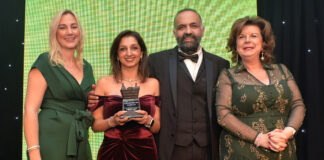 Shamly and Vikas Sud, whose GHSL Ltd business owns Premier RaceTrack Pitstop Bearsden, are congratulated by Laura McDermaid, of Philip Morris, and Scottish Grocer Awards host Elaine C Smith.