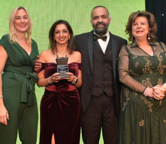 Awards Profile – The Innovation Award Shamly and Vikas Sud, whose GHSL Ltd business owns Premier RaceTrack Pitstop Bearsden, are congratulated by Laura McDermaid, of Philip Morris, and Scottish Grocer Awards host Elaine C Smith.
