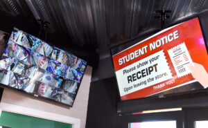Student receipts are hand-checked by staff before they leave the shop.