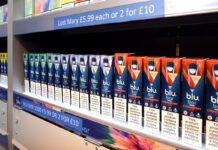 A row of Blu Bar disposable vapes in a gantry.