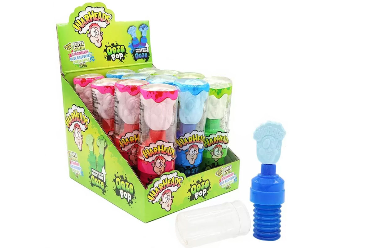 Pack shot of Warheads Sour Ooze Pops with a the Blue Raspberry flavour Pop sitting outside the box.