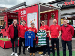 Kellanova kicks off football camps campaign The Kellanova team with the Kellogg's-branded "changing room" van during their visit to Scotland.