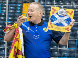 Brownings builds support for national team with new pie A man is seen going to eat a pastry pie wearing the Scotland Football Team's top and holding a Lion Rampant flag as well as a card with the branding for Browning's The Tartan Army Pie.